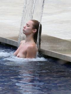 Una Healy topless in a pool