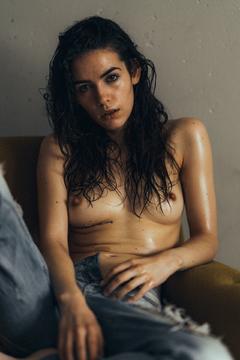 Frankie Miles sitting topless