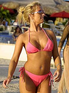 Young Britney Spears in pink bikini on a beach