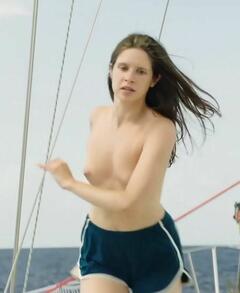 Daphne Patakia topless on a boat at Tout le monde m'appelle Mike
