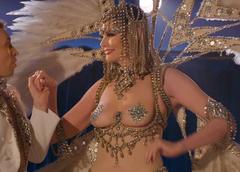 Geena Davis topless with pasties in Glow