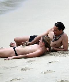 Kate Moss sunbathing topless with honey