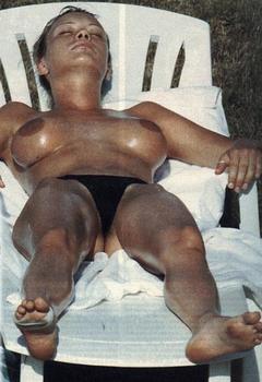 Anna Falchi sunbathing topless