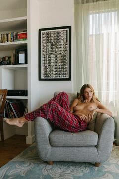 Maddy Elmer topless in an armchair by Sam Livm
