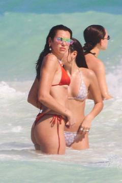 Dua Lipa in red bikini by the beach in Tulum