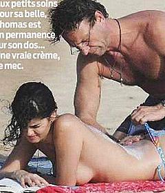 Shermine Shahrivar sunbathing topless on a beach