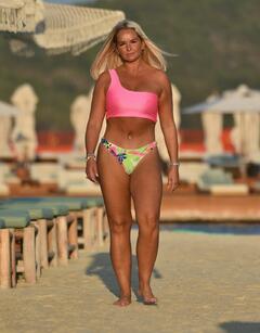 Jennifer Ellison in pink bikini on a beach