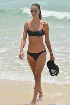 Alessandra Ambrosio in black bikini on a beach in Florianopoli