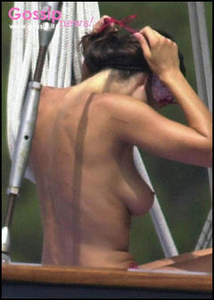 Manuela Arcuri topless on a boat paparazzi photo