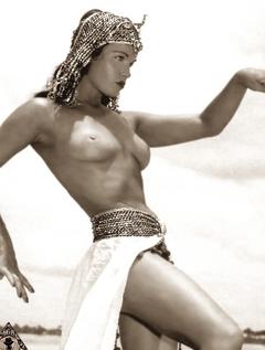 Bettie Page posing topless