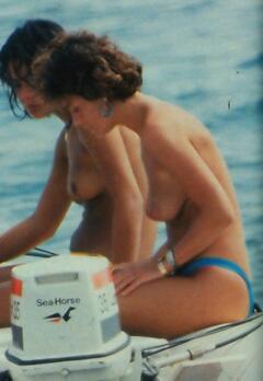 French actress Corinne Clery topless on a boat paparazzi image