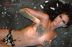 Veruska Ramirez lying topless cover her tits