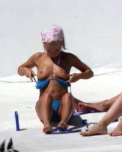 Geri Halliwell changing on a beach shows her nude tits