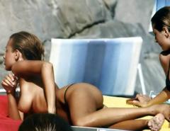 Benedetta Valanzano sunbathing topless on a beach