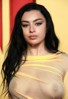Charli XCX see through to piersed boobs at Vanity Fair Oscar Party in Beverly Hills