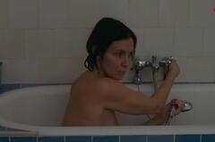 Geraldine Pailhas naked in abathtub at Les malvenus