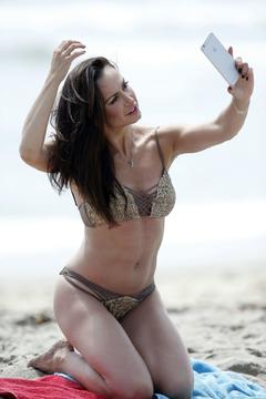 Karina Smirnoff in bikini doing selfie on a beach, Santa Monica