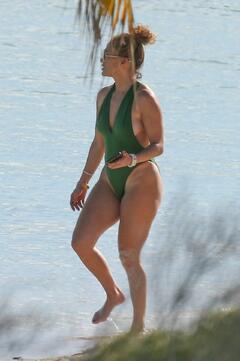 Jennifer Lopez in green swimsuit at a beach in Turks and Caicos - January 2021