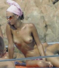 Ludmilla Radchenko sunbathing topless on a yacht