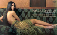 Patricia Velasquez naked but covered on a sofa