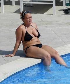 Chanelle Hayes in black bikini poolside in Spain