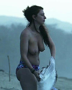 Lola Naymark topless on a beach in Au Fil D'Ariane