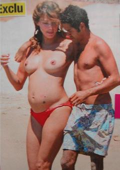 Pregnant Melissa Theuriau topless on a beach