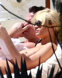 Paris Hilton sunbathing topless