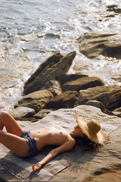 Anthea Page sunbathing topless