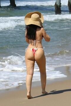 Natasha Blasick in red bikini while enjoying a day at the beach in Hermosa - March 2025