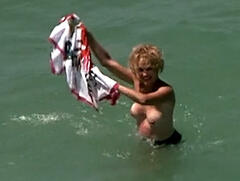 Jessica Lange topless in a water at Blue Sky