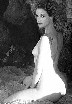 Alison Eastwood naked on a beach