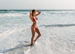 Getriin Kivi in red bikini on a beach
