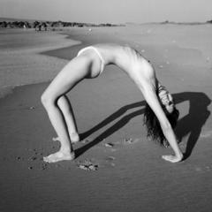 Judith Leclerc topless on a beach