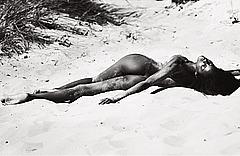 Ebonee Davis lying fully nude on a beach