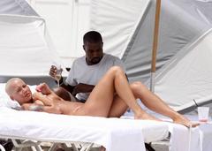 Amber Rose sunbathing braless
