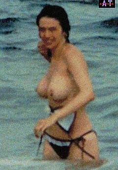 Beatriz Rico caught topless on a beach