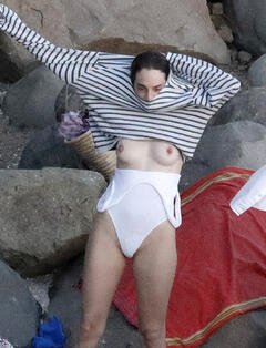 Maya Hawke changing on a beach shows her nude tits in St. Barths