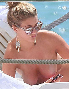 Amy Willerton sunbathing topless in Cannes