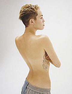 Miley Cyrus topless covered