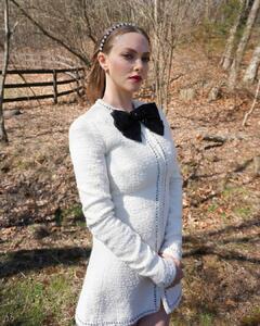Amanda Seyfried posing in white dress