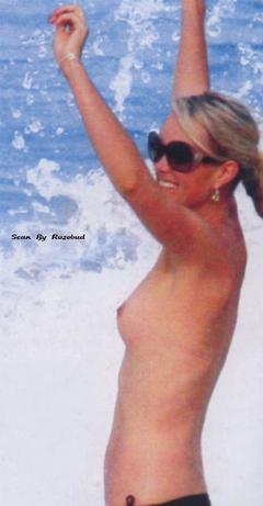 Laeticia Hallyday topless in a water