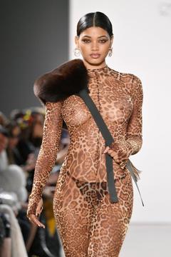 Danielle Herrington braless in see through dress walks the runway for the LaQuan Smith Fashion Show during NYFW
