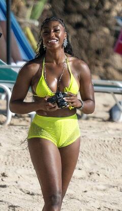 Charokee Young in yellow bikini during beach photoshoot in Western Barbados - March 2025