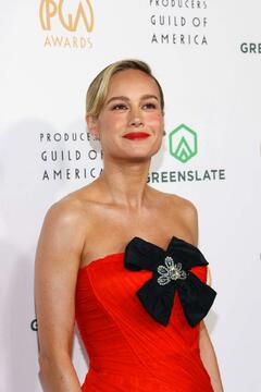 Brie Larson in red dress at 35th Annual Producers Guild Awards at The Ray Dolby Ballroom in Hollywood - February 2024