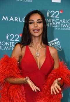 Madalina Diana Ghenea cleavage in red dress at day four of the 22nd Monte-Carlo Film Festival De La Comedie in Monaco - November 15, 2025