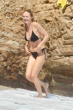 Heather Graham in black bikini on the beach in LA