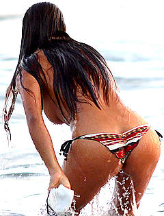 Fernanda Marin in a bikini loses her top at the beach in Malibu