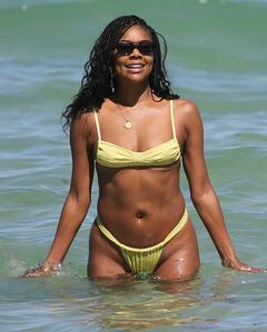 Gabrielle Union in yellow bikini on the beach in Miami - April 2023