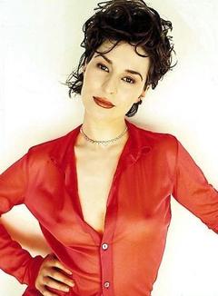 Helen Baxendale pokies in red blouse